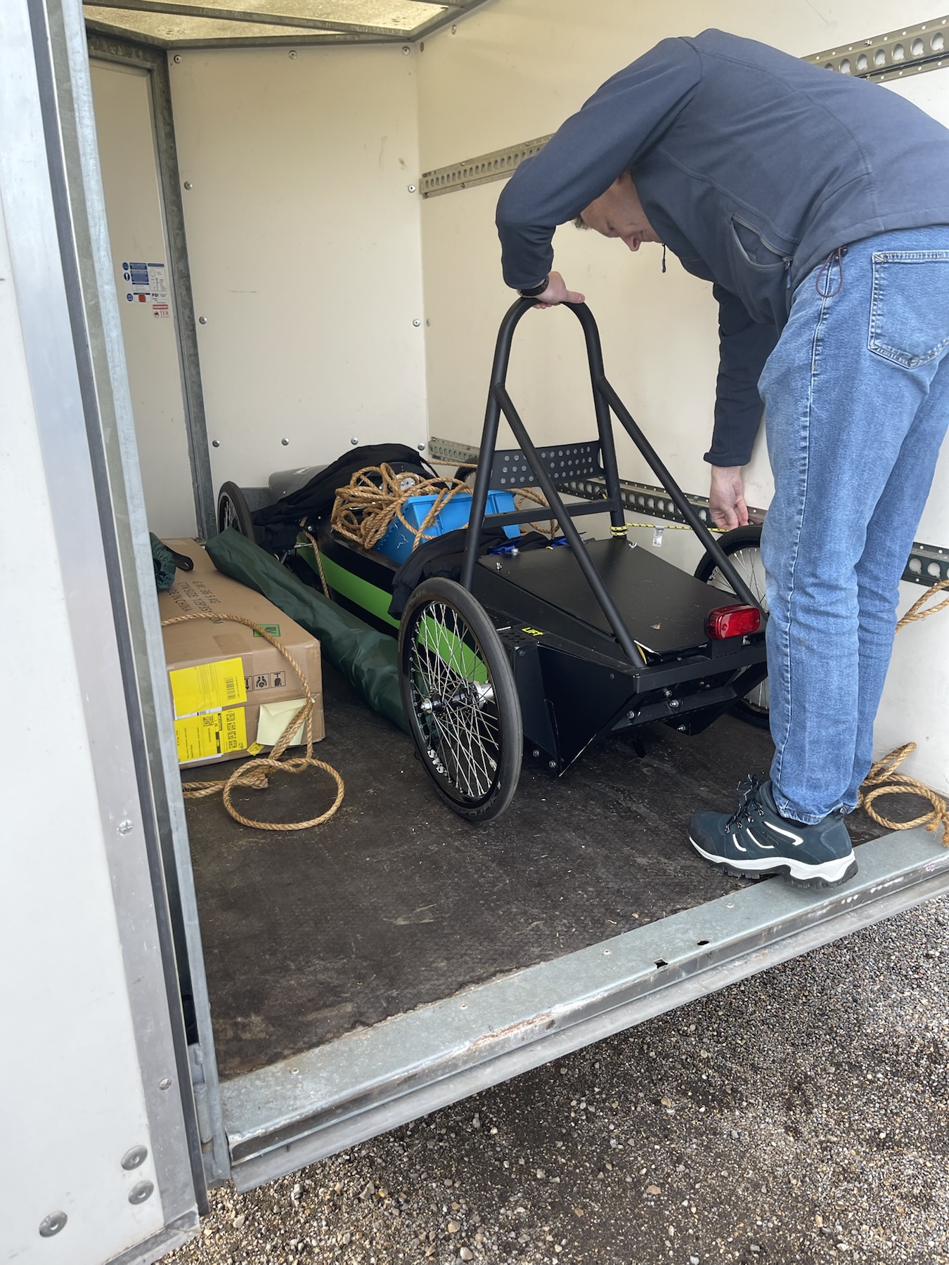 Preparing the electric race car in the Mallory Park paddock garage